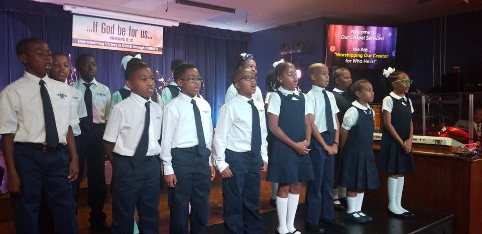 Students singing at a chapel service
